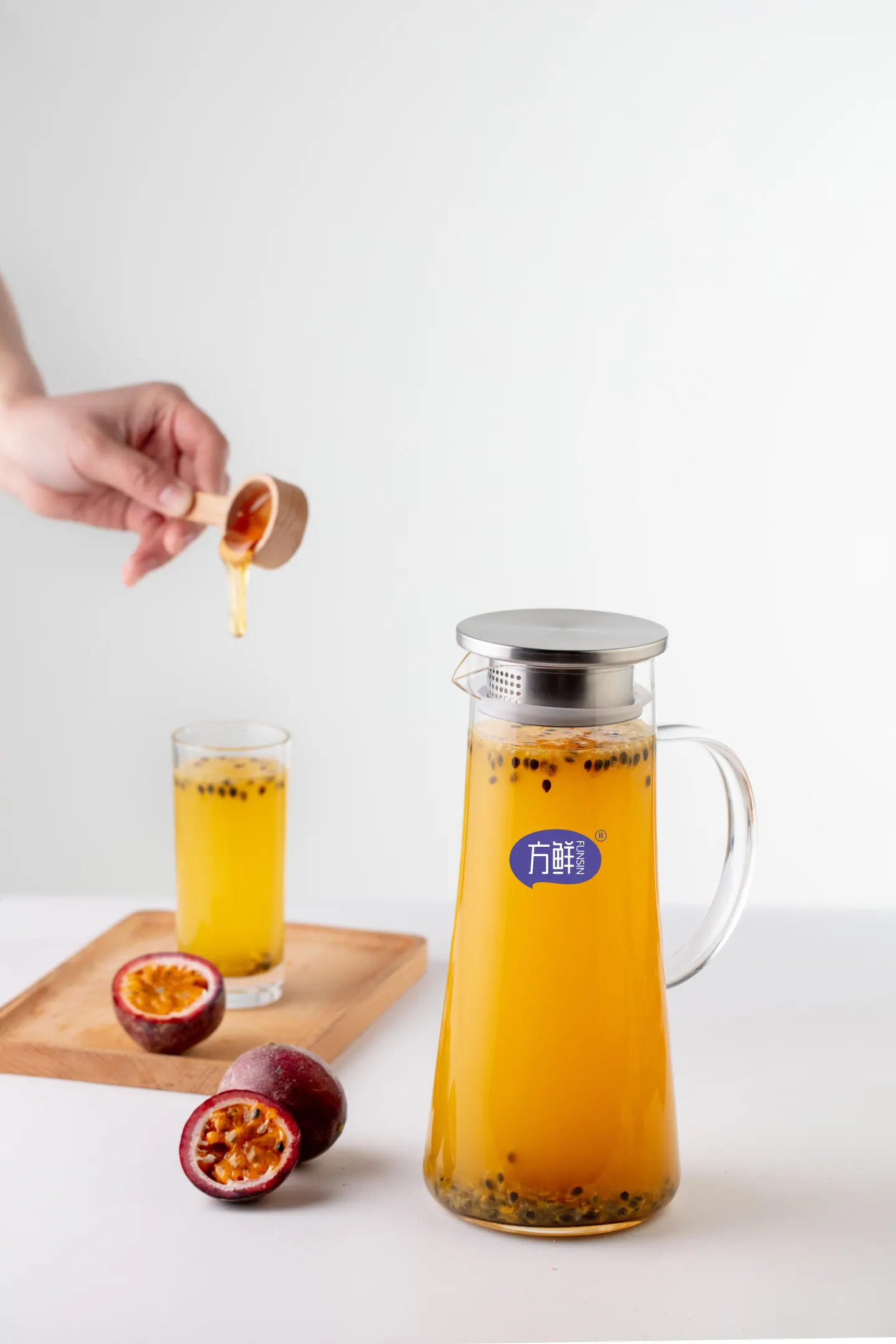 Honey being added to a passion fruit drink